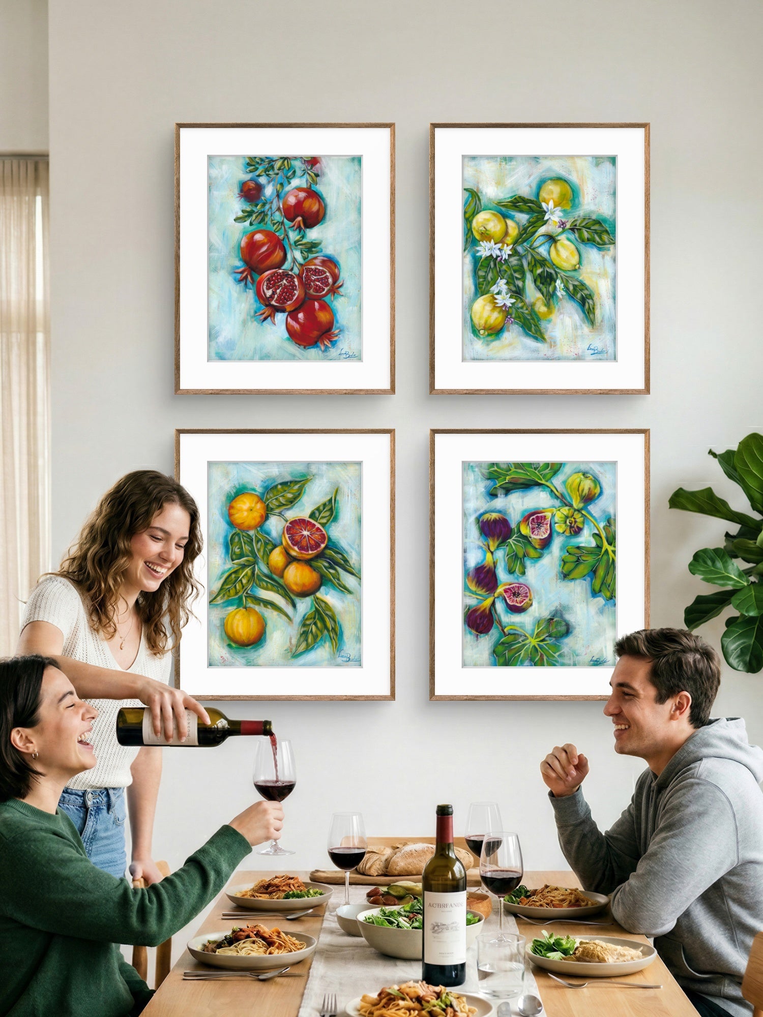 People enjoying a meal together with colorful Luna Burlo fruit paintings on the wall.