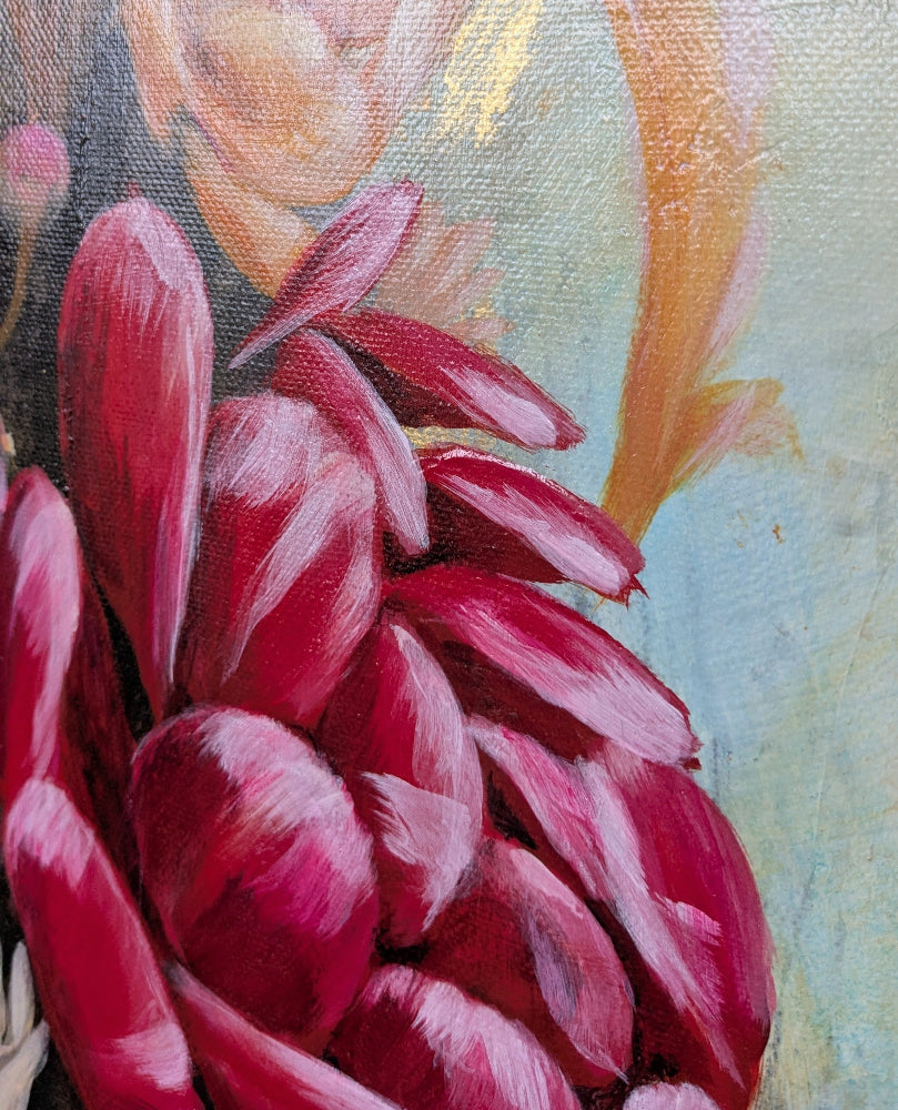 Close-up of a painting with red flowers and a blurred background