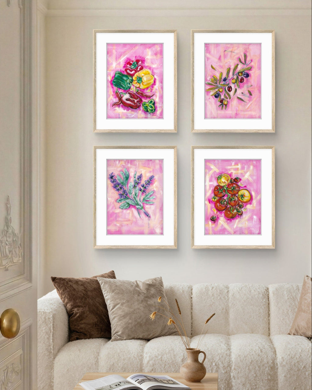 Living room with a beige sofa, wooden coffee table, and four framed floral Luna Burlo artworks on the wall.