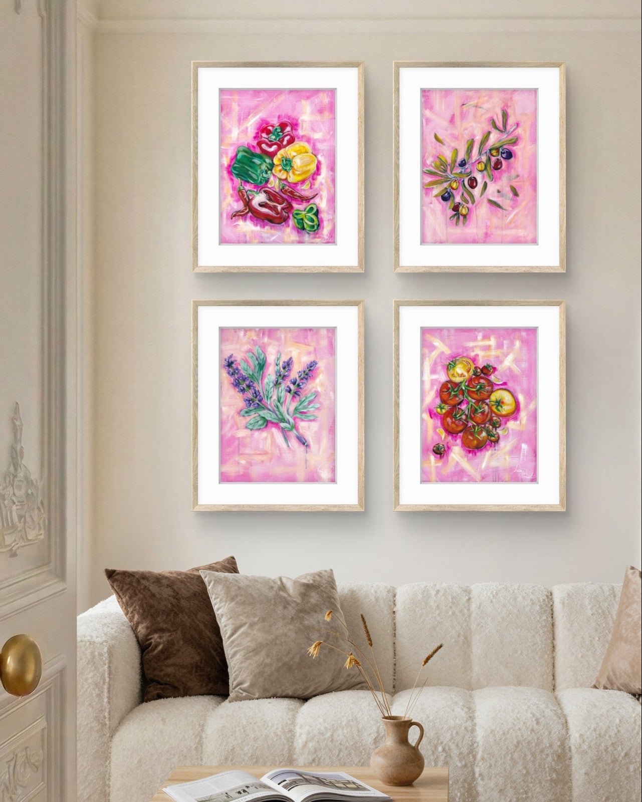 Living room with a beige sofa, wooden coffee table, and four framed floral Luna Burlo artworks on the wall.