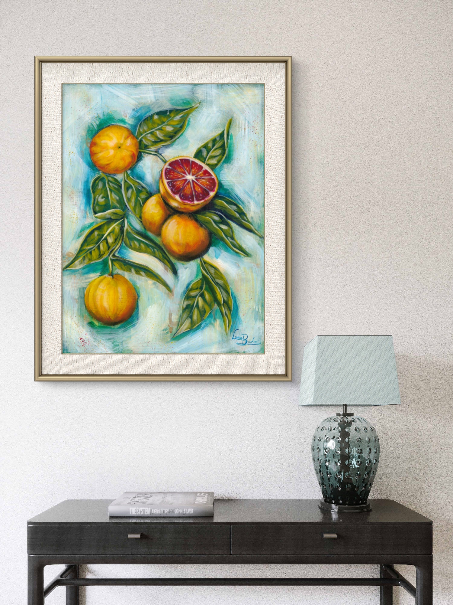 Framed Luna Burlo painting of blood oranges on a living room or hallway wall above a dark wooden console table with a lamp.

Framed Luna Burlo fine art paper print or her original artwork of Blood Oranges from series "Mediterranean Table".

Colorful abstract food art with orange fruit, vibrant green leaves, and turquoise blue background. Rectangle vertical or portrait orientation. Made in Melbourne, Australia 