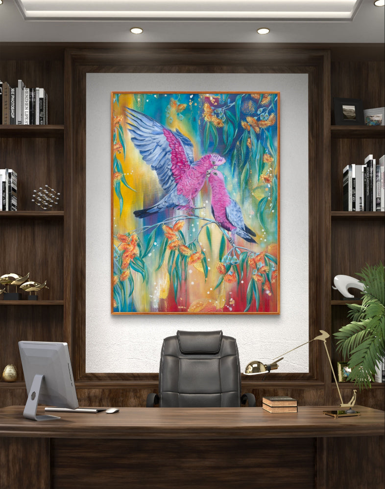 Colorful abstract fine art canvas print of a Luna Burlo painting of an Australian Native galah bird and gum tree flowers on a modern office wall about a desk. Red, blue, yellow background, with rectangle vertical or tall portrait orientation. From Melbourne, Australia