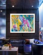 large colorful  fine art print of a painting of Native Australian galah birds and native flowers on a wall in a modern living room or restaurant/bar. Artwork by Luna Burlo, Melbourne, Australia.