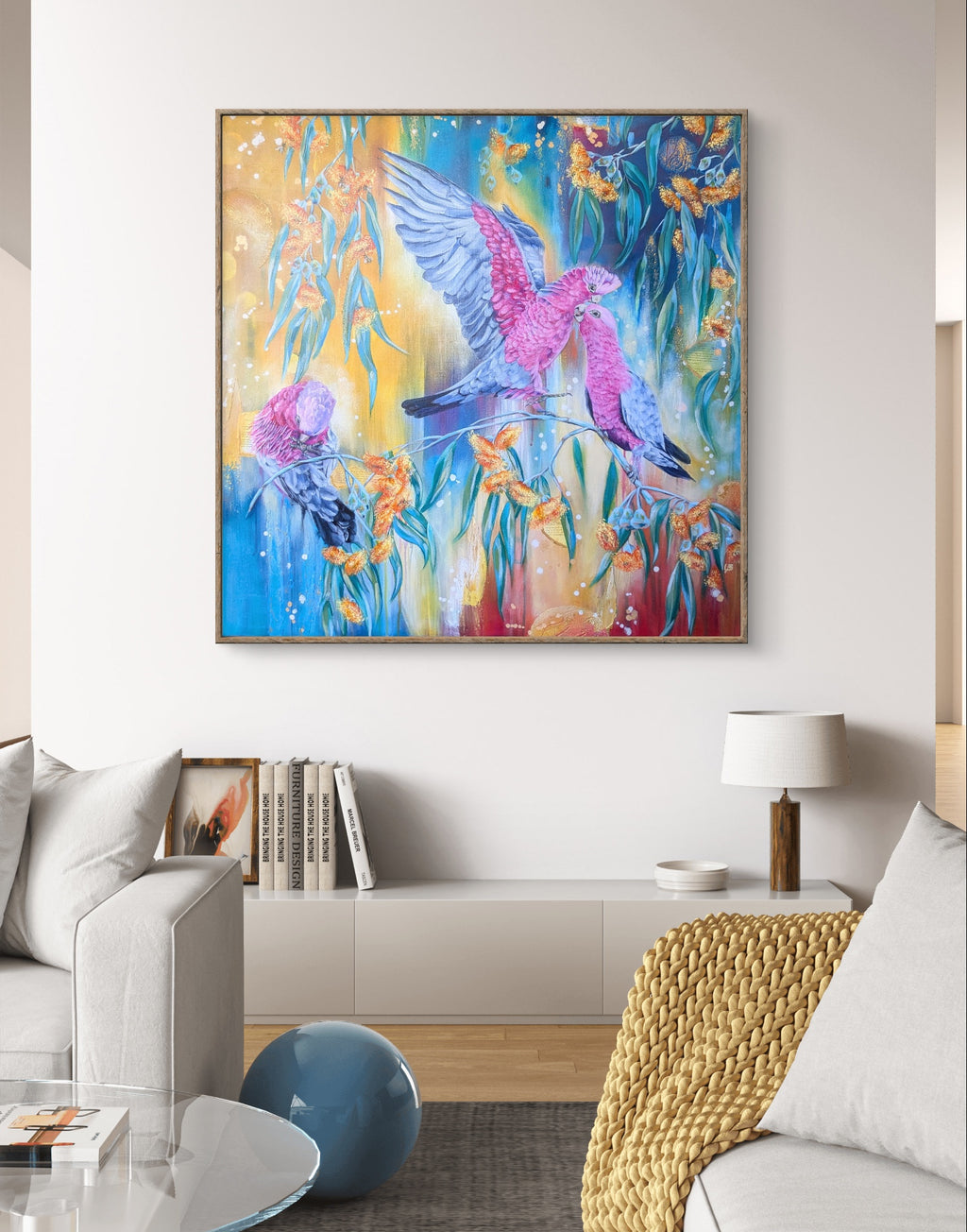 Colorful large abstract painting or art print of Australian galah birds and gum tree / eucalyptus flowers in a living room setting. Artist, Luna Burlo, Melbourne
