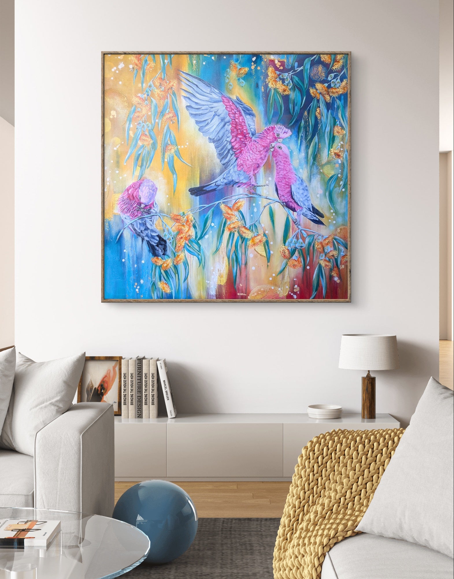 Colorful large abstract painting or art print of Australian galah birds and gum tree / eucalyptus flowers in a living room setting. Artist, Luna Burlo, Melbourne