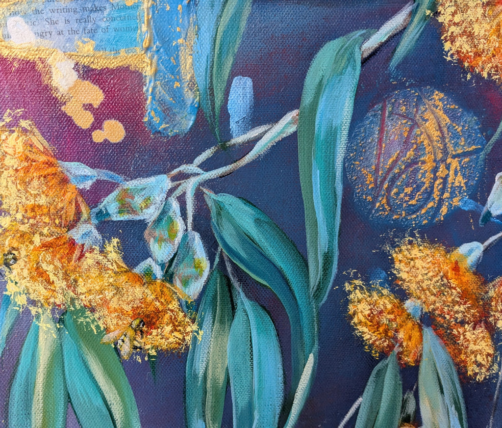 Artistic depiction of flower blossoms and eucalyptus gum leaves with a blue background, gold, and collage. Art by Luna Burlo, Melbourne, Australian made