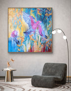 Large colorful abstract painting or fine art print of pink Native Australian galah birds and orange gum tree blossoms flowers on a modern living room wall above a gray armchair. Art by Melbourne art, Luna Burlo