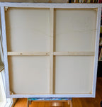 "Blush in the Branches" large wooden picture frame with a white mat on a wooden floor. Artist, Luna Burlo, signature on back. Melbourne, Australia