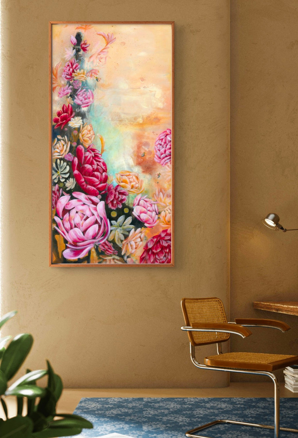 Colorful pink and red abstract floral painting on a beige wall with a desk, chair and lamp in the foreground of a warm but modern office. Artist, Luna Burlo, Melbourne, Australia
