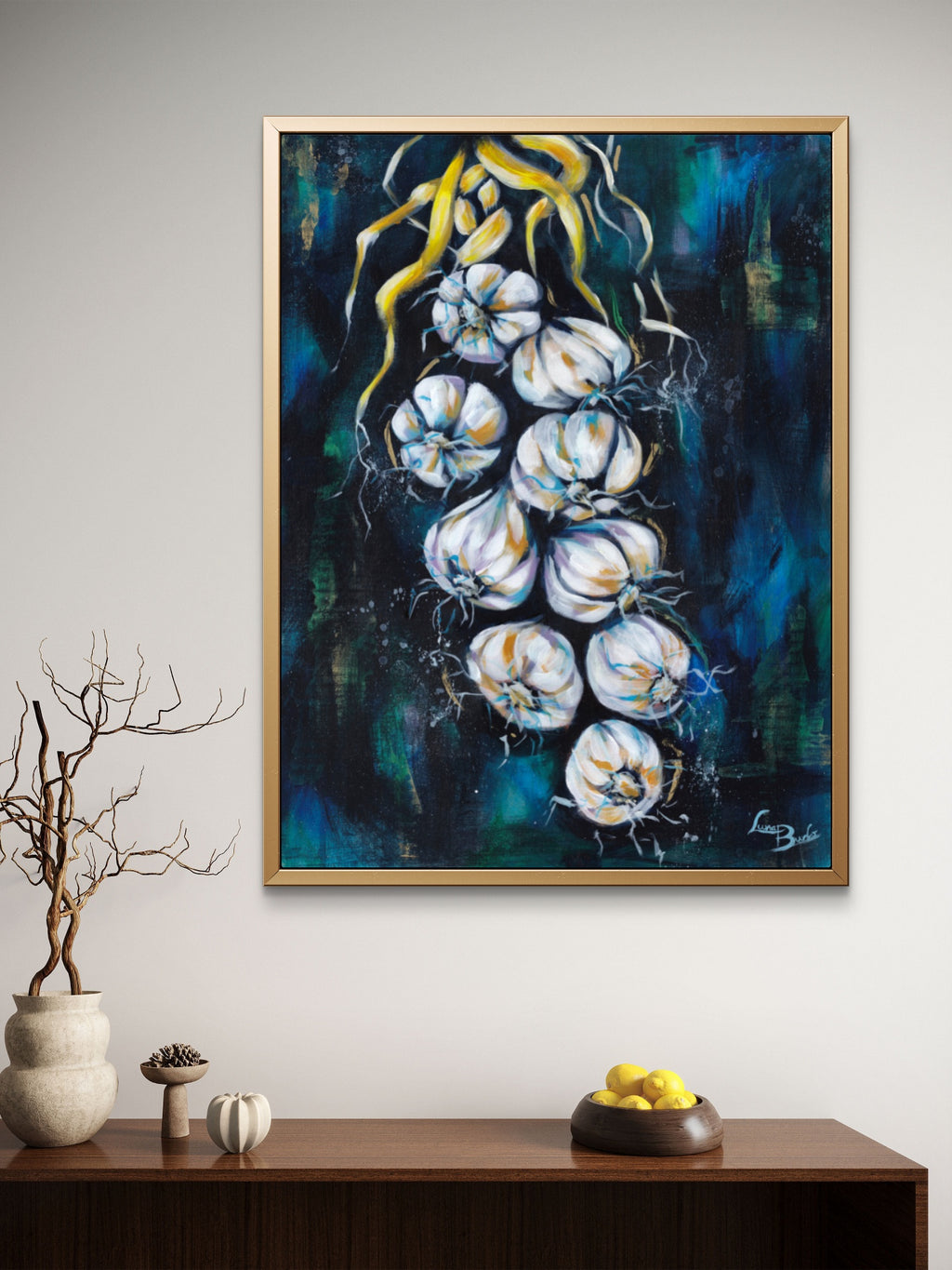 Framed Luna Burlo abstract artwork of braided garlic on a light beige or white living room wall above a wooden console table.

Fine art paper print or her original artwork of "Garlic" from series "Mediterranean Table".

Colorful abstract food art with white, and gold accents on a dark blue and green background. Rectangle vertical or portrait orientation. Made in Melbourne, Australia