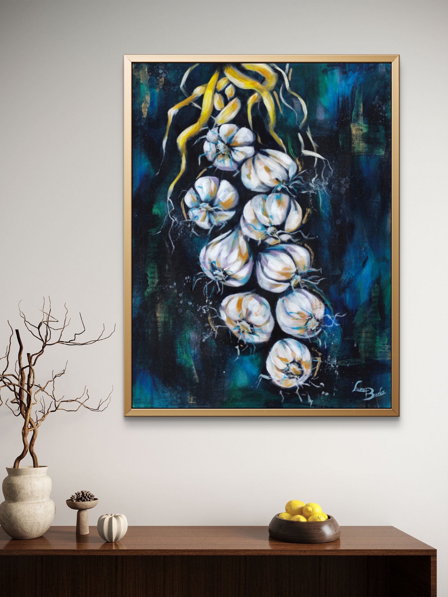 Framed Luna Burlo abstract artwork of braided garlic on a light beige or white living room wall above a wooden console table.

Fine art paper print or her original artwork of "Garlic" from series "Mediterranean Table".

Colorful abstract food art with white, and gold accents on a dark blue and green background. Rectangle vertical or portrait orientation. Made in Melbourne, Australia