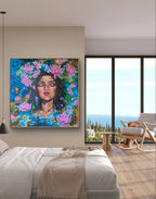 Modern apartment bedroom feature wall with a large painting or fine art print of a woman with pink lotus and yellow / white lukspur flowers. "July in Bloom" art by Luna Burlo, Australia