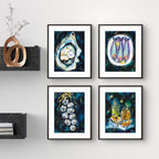 Four framed Luna Burlo artworks on a wall with a decorative vase and shelves below.

Framed Luna Burlo fine art paper print or her original artworks of Oyster, Sardines, Garlic, and Honey and Oil from series "Mediterranean Table".

Dramatic "Dark" set with white, yellow, gold, black, dark blues and greens background. Rectangle portrait or vertical orientation. Made in Melbourne, Australia