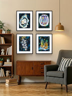 Living room with framed Luna Burlo artwork on the wall, a grey armchair, and a wooden cabinet.

Framed Luna Burlo fine art paper print or her original artworks of Oyster, Sardines, Garlic, and Honey and Oil from series "Mediterranean Table".

Dramatic "Dark" set with white, yellow, gold, black, dark blues and greens background. Rectangle portrait or vertical orientation. Made in Melbourne, Australia