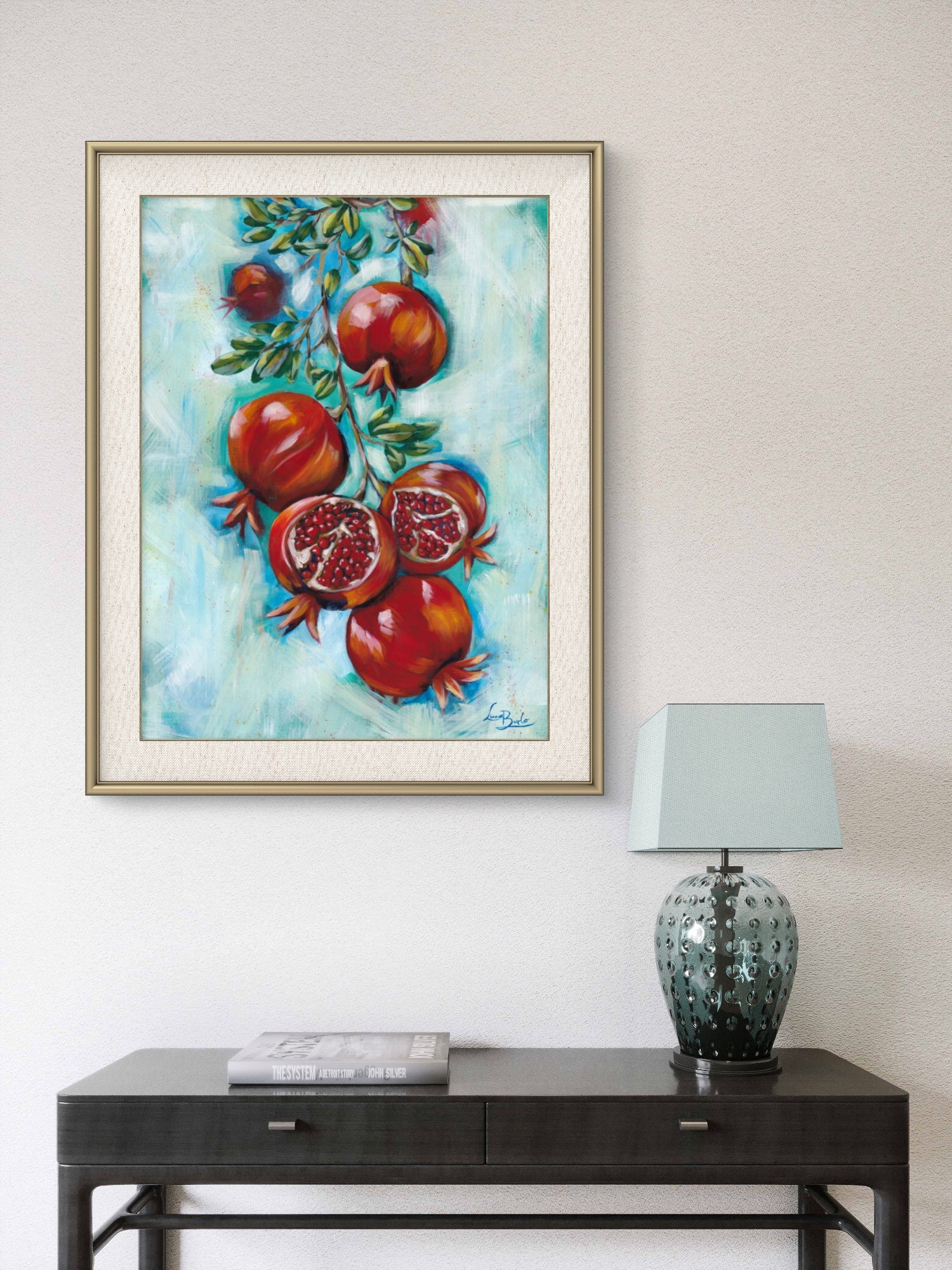 Framed Luna Burlo painting of pomegranates on a white living room or hallway wall above a console table with a lamp.

Luna Burlo fine art paper print or her original artwork of Pomegranates from series "Mediterranean Table".

Colorful abstract food art with red fruit, vibrant green leaves, and turquoise blue background. Rectangle vertical or portrait orientation. Made in Melbourne, Australia