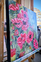 SIde view of colorful Luna Burlo abstract floral painting with pink and red Native Australian tea tree flowers and a white flower in the center, with green and gold background. Square orientation. Made in Melbourne, Australia