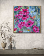 Colorful Luna Burlo original abstract floral painting with pink and red Native Australian tea tree flowers and a white flower in the center, with green and gold background. Square shape, modern industrial contrast against grey wall styling suggestion. Made in Melbourne, Australia