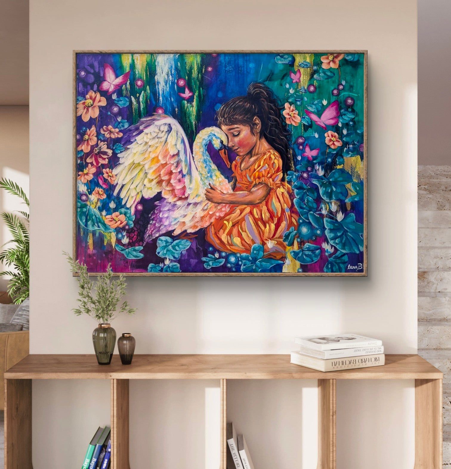 Colorful painting of a girl with a swan and butterflies on a wall above a wooden console table in hall. Luna Burlo, Melbourne, Australia