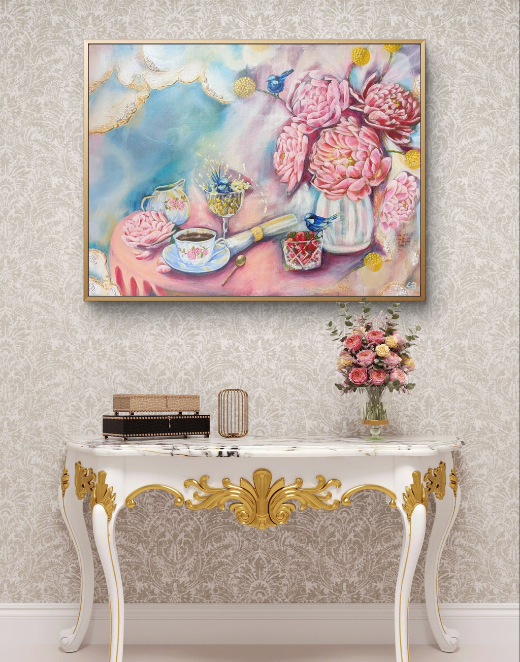 Decorative console table with a pink and blue Luna Burlo floral painting or fine art print above it on a wall. Australia.