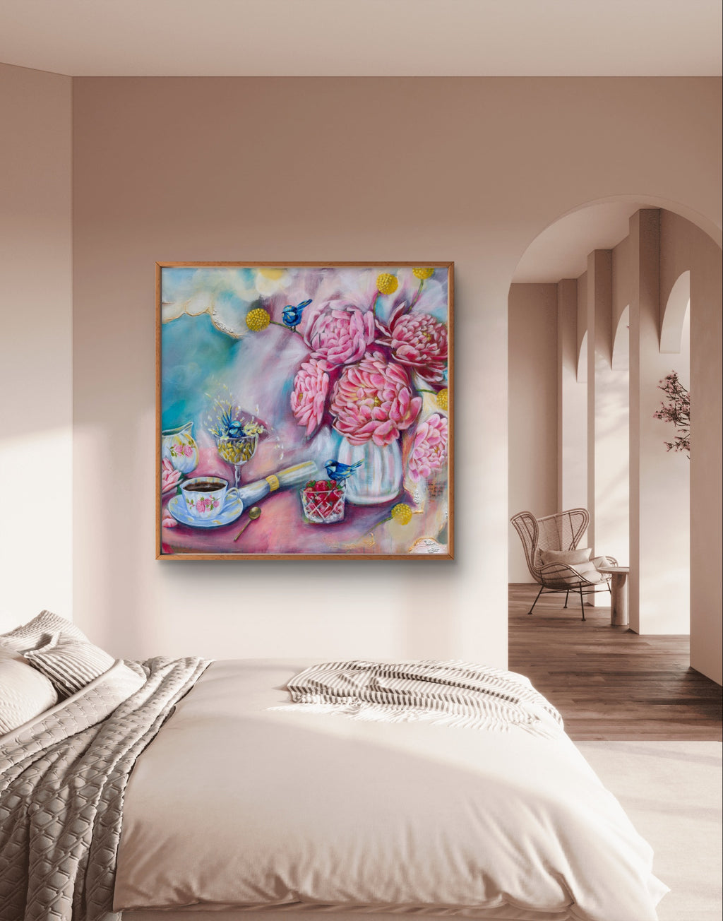 Colorful pastel blue and pink floral fine art canvas print of a painting on a cream wall above a bed in a bedroom. The painting is square and features pink peonies, and Native Australian birds (fairy wrens) and flowers (billy buttons). Artist: Luna Burlo, Melbourne, Australia